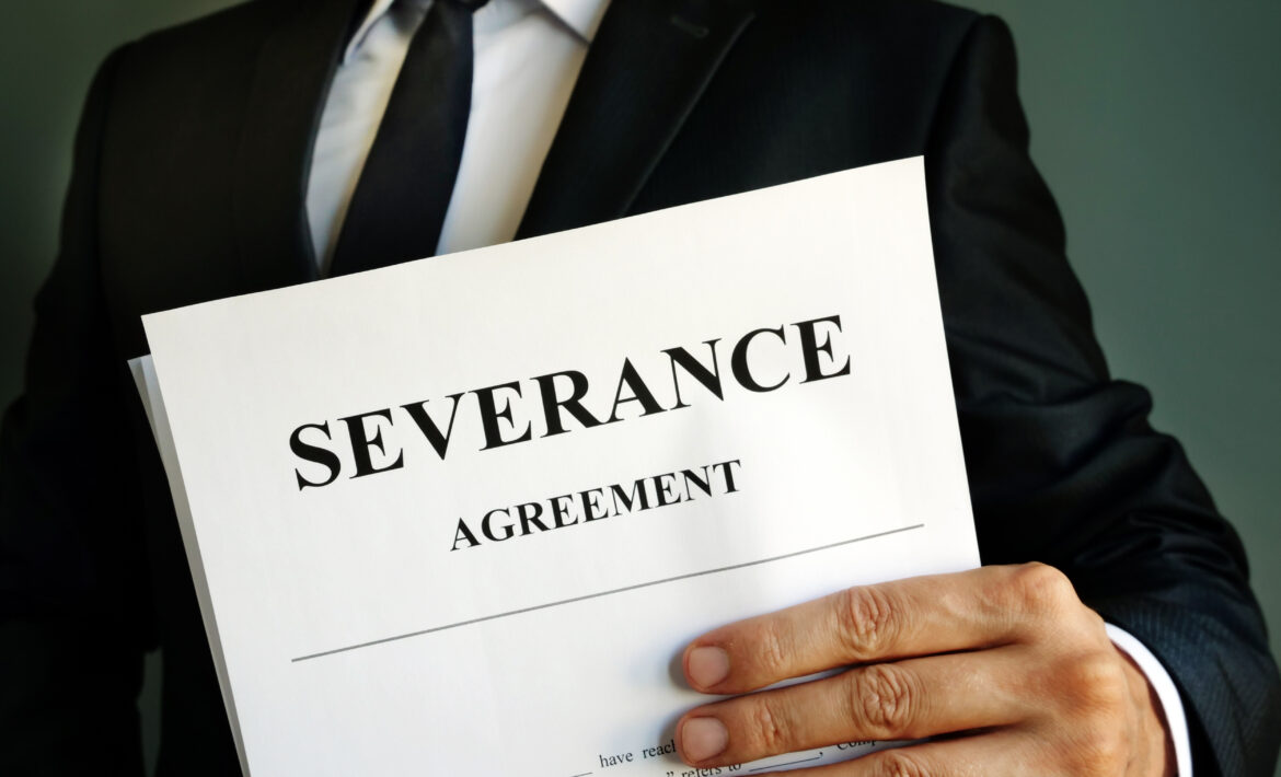 Manager,Is,Holding,Severance,Agreement,Papers.