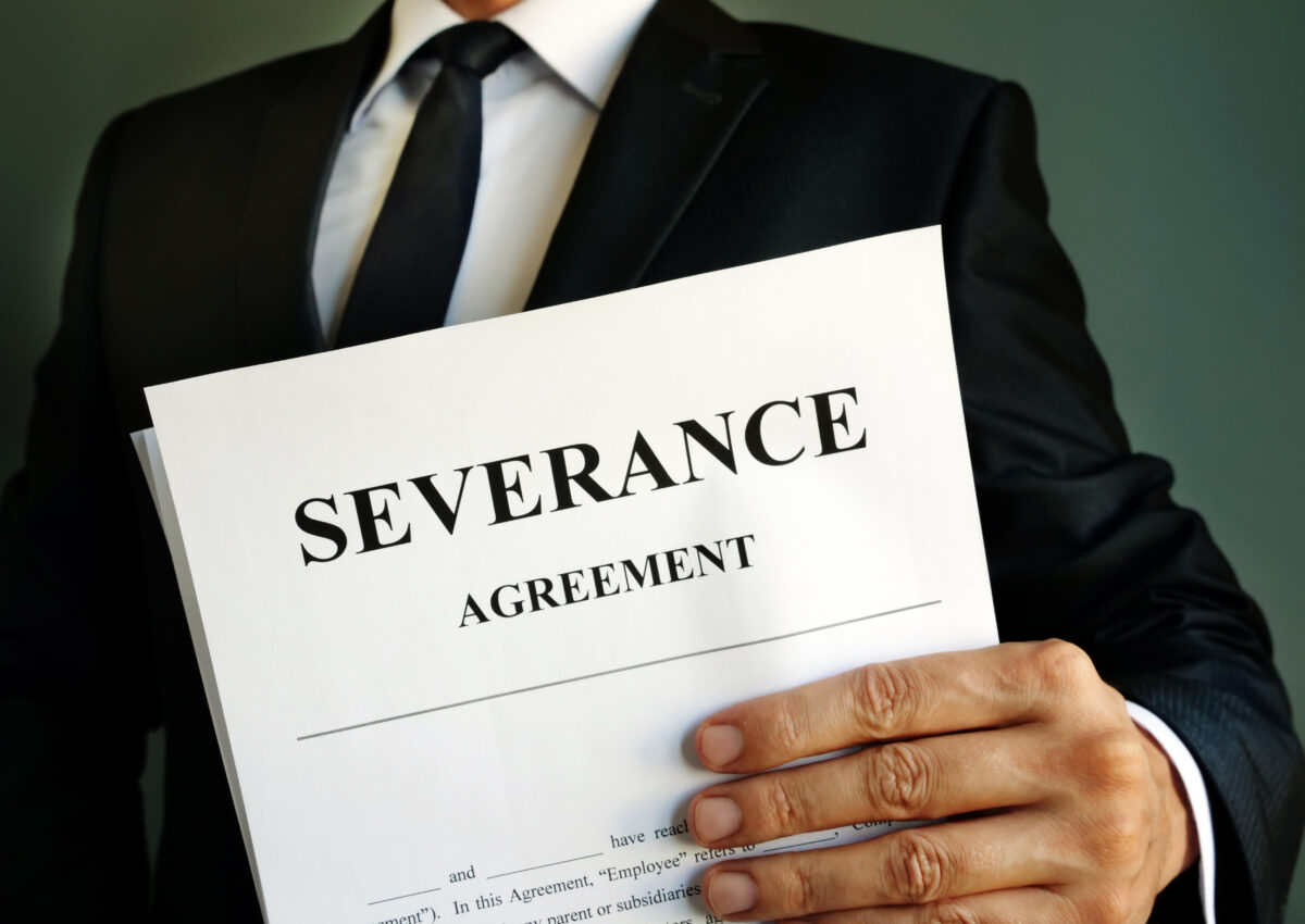 Manager,Is,Holding,Severance,Agreement,Papers.